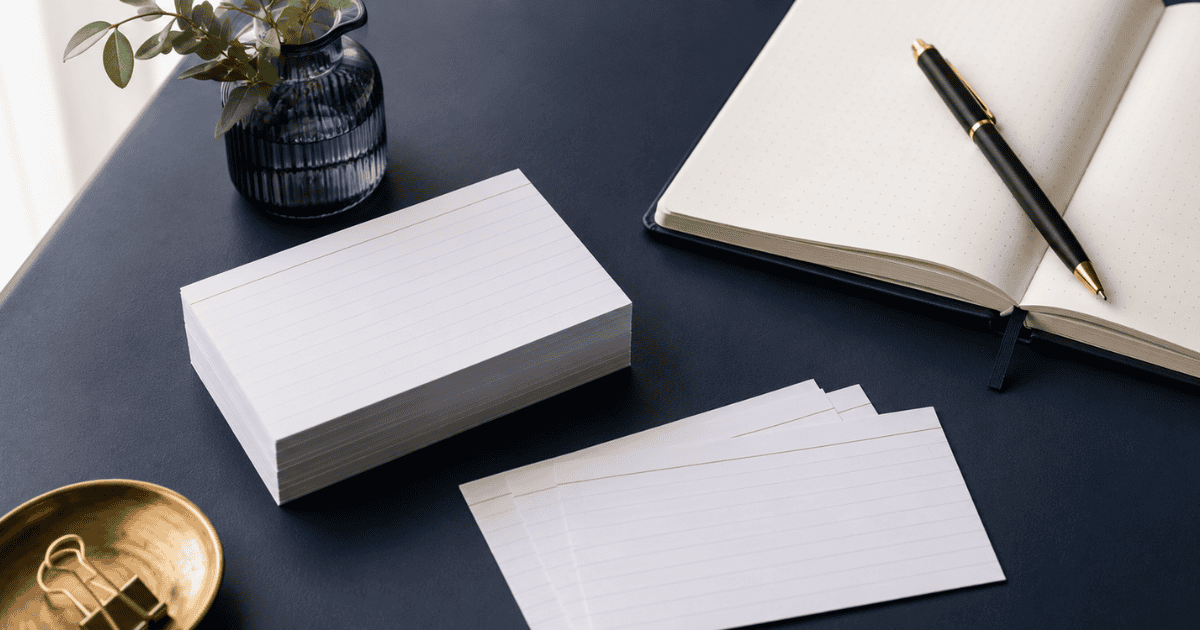 Flashcards and notebook arranged for spaced repetition and active recall memory practice